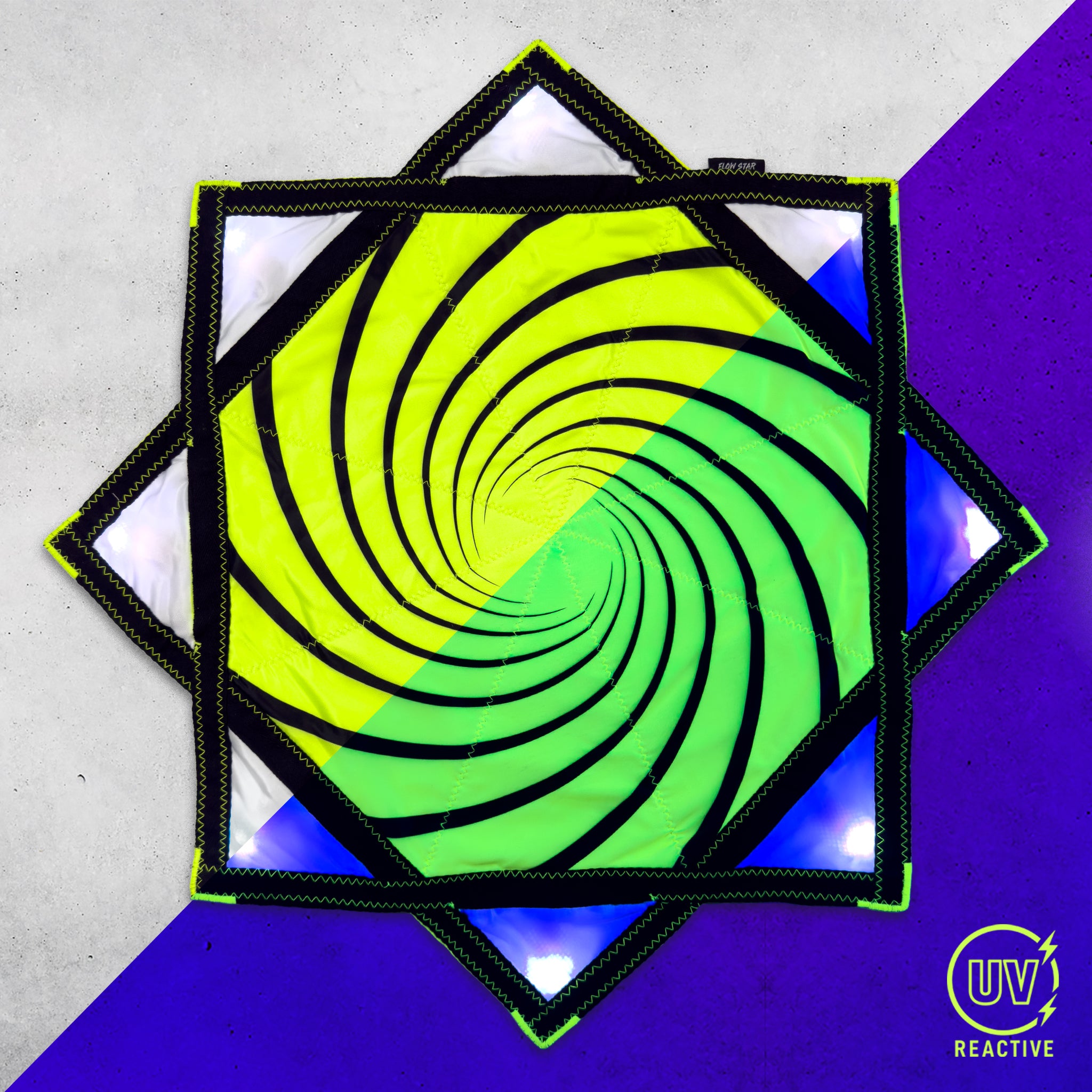 Spiral 6 - LED Flow Star by First Earth, illuminated view showing the colorful LED lighting across the printed fabric