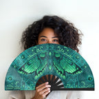 Luna Moth UV glow hand fan by First Earth – collapsible rave accessory with glowing moth design, bamboo ribs, and vibrant polyester fabric for late-night flow