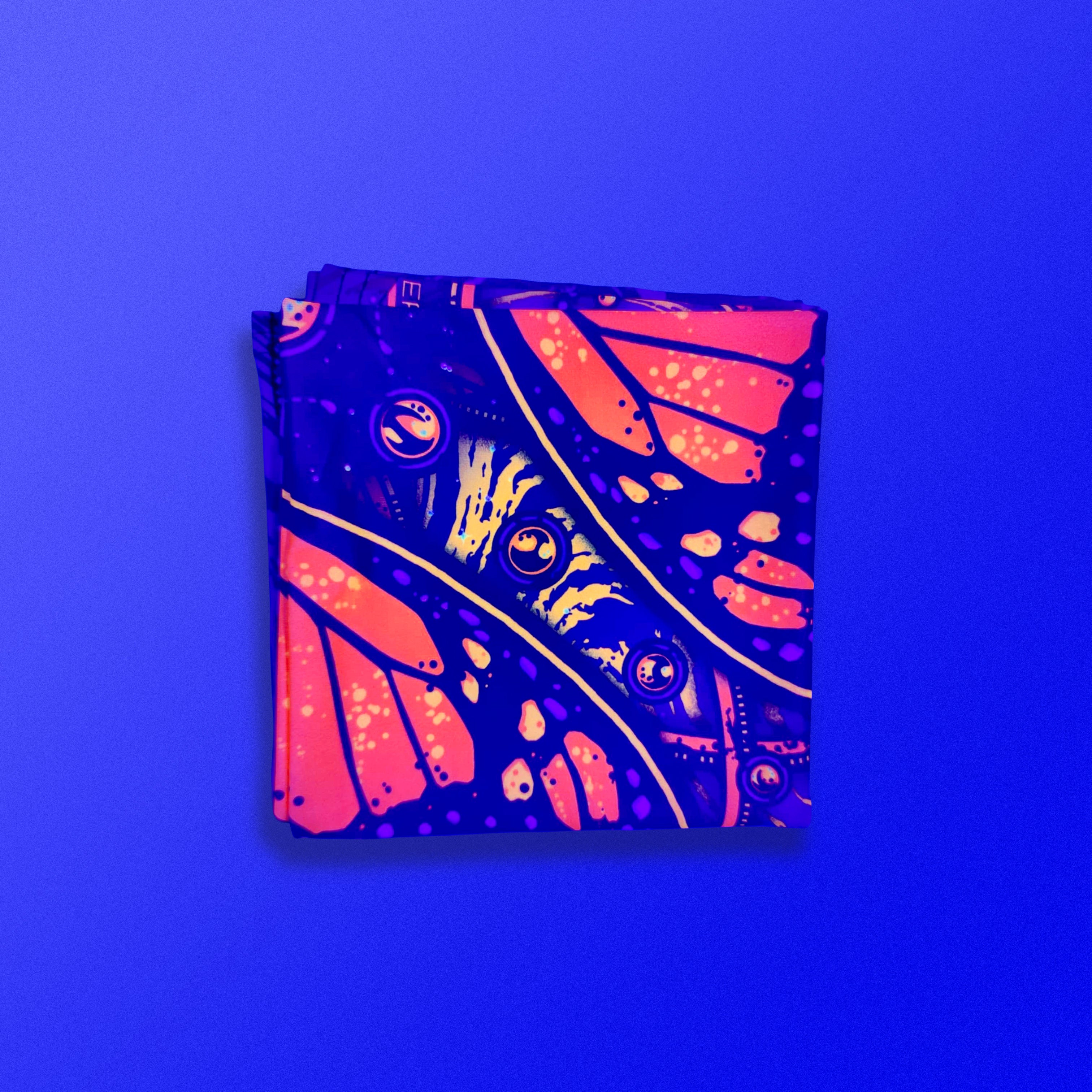 Monarch UV glow bandana by First Earth – lightweight rave accessory with glowing butterfly design, breathable and festival-ready 
