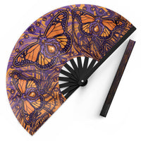 Monarch UV glow hand fan by First Earth – folding rave fan with glowing butterfly design, bamboo ribs, and vibrant polyester fabric that snaps open for a cool breeze 