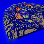 Monarch UV glow hand fan by First Earth – folding rave fan with glowing butterfly design, bamboo ribs, and vibrant polyester fabric that snaps open for a cool breeze 