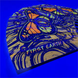 Monarch UV glow hand fan by First Earth – folding rave fan with glowing butterfly design, bamboo ribs, and vibrant polyester fabric that snaps open for a cool breeze 