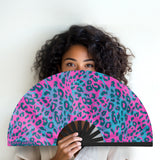 Neon cheetah UV glow folding hand fan designed for raves and music festivals.