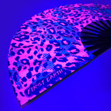 Neon cheetah UV glow folding hand fan designed for raves and music festivals.
