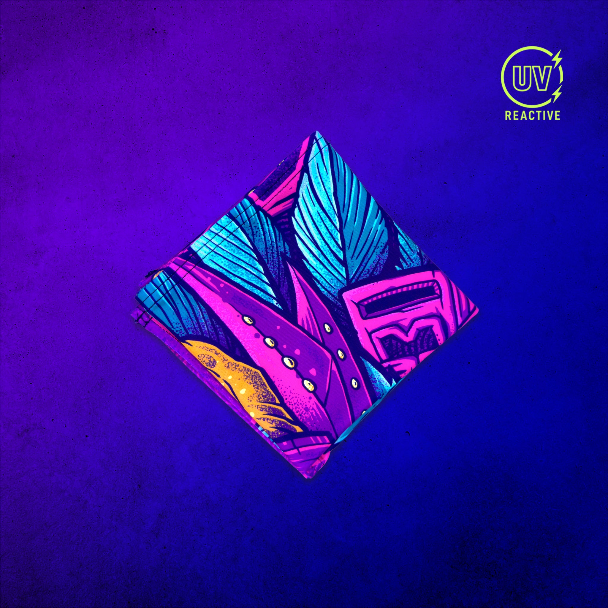 PsyTiger UV glow bandana folded into a square and glowing under blacklight