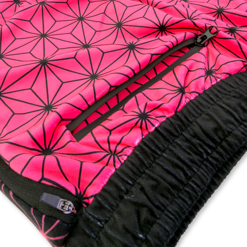 Close up of First Earth Asanoha Pink velvet jogger shorts hip zipper pocket and soft fabric