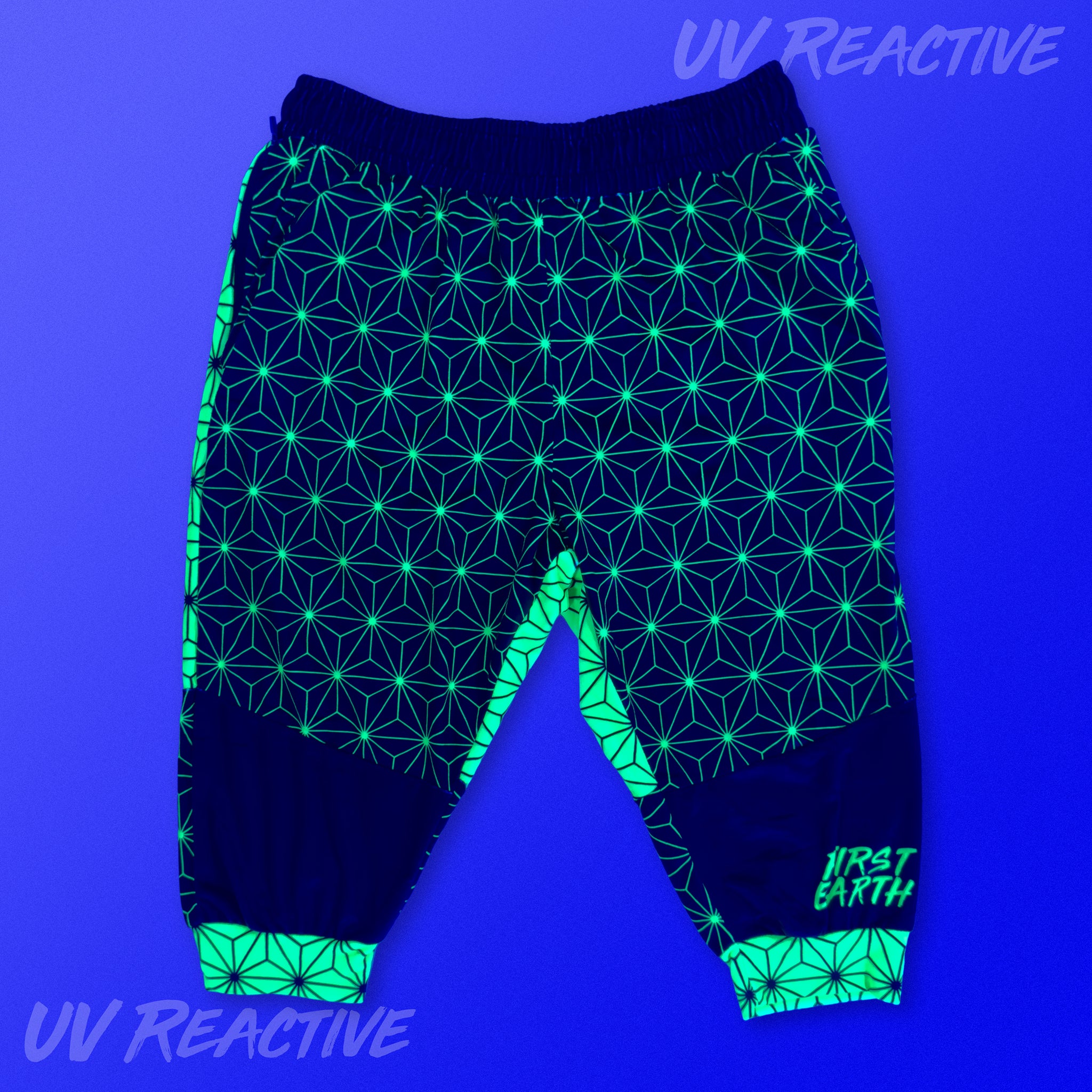 First Earth Asanoha Yellow UV velvet 3/4 jogger shorts glowing under UV black light
