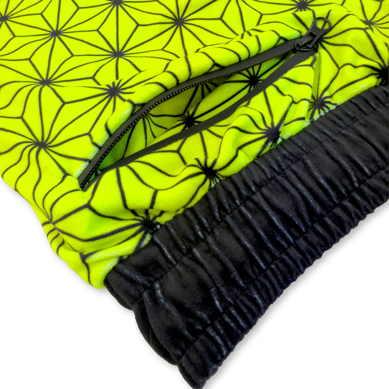 Close up of First Earth Asanoha Yellow velvet jogger shorts hip zipper pocket and soft fabric
