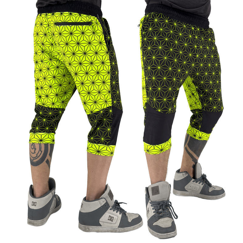 First Earth Asanoha Yellow three-quarter velvet harem shorts on model, showing front and back views with yellow geometric pattern