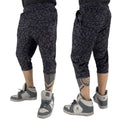 First Earth Midnight Cheetah 3/4 velvet harem shorts on model showing front and back views with dark cheetah print