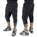 First Earth Midnight Cheetah 3/4 velvet harem shorts on model showing front and back views with dark cheetah print
