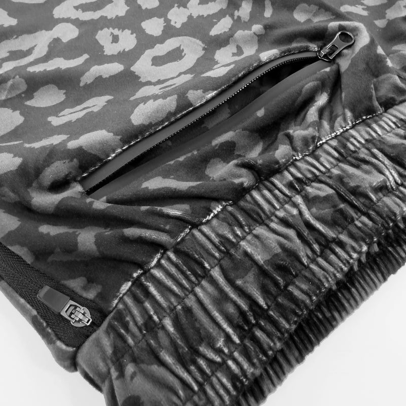 First Earth Midnight Cheetah jogger shorts close up showing back zipper pocket and soft velvet fabric