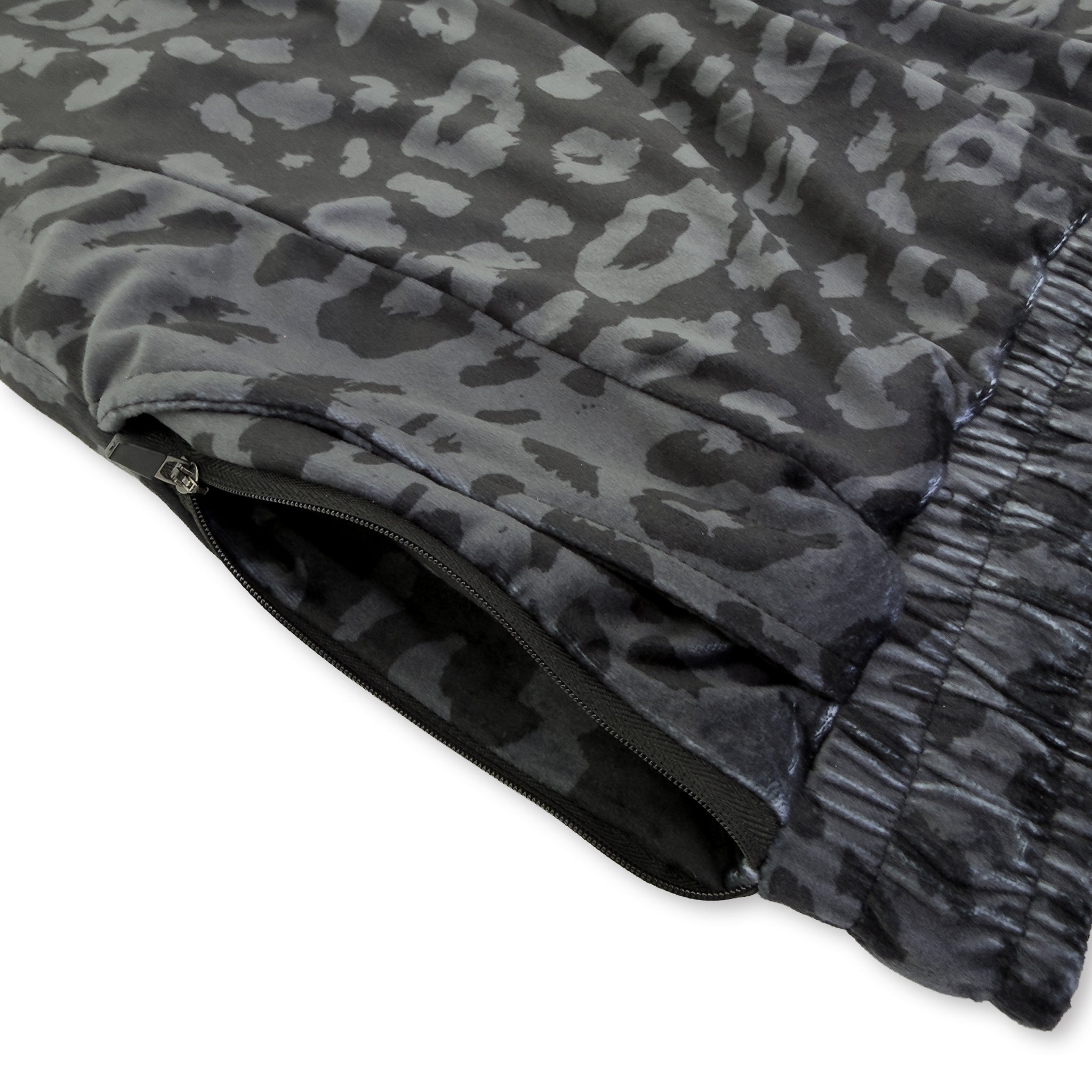 First Earth Midnight Cheetah jogger shorts close up showing side zipper pocket and dark velvet fabric