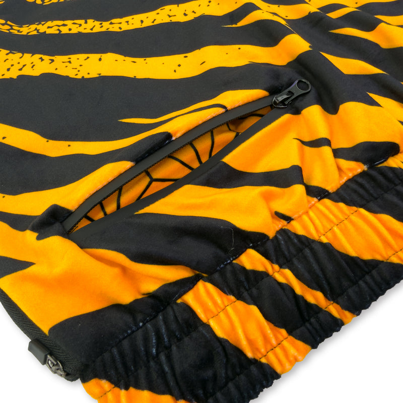 First Earth Sacred Stripes jogger shorts close up showing back zipper pocket and orange black velvet fabric