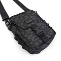 First Earth Midnight Cheetah sling bag front view with buckle closure and logo patch