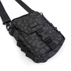 First Earth Midnight Cheetah sling bag front view with buckle closure and logo patch