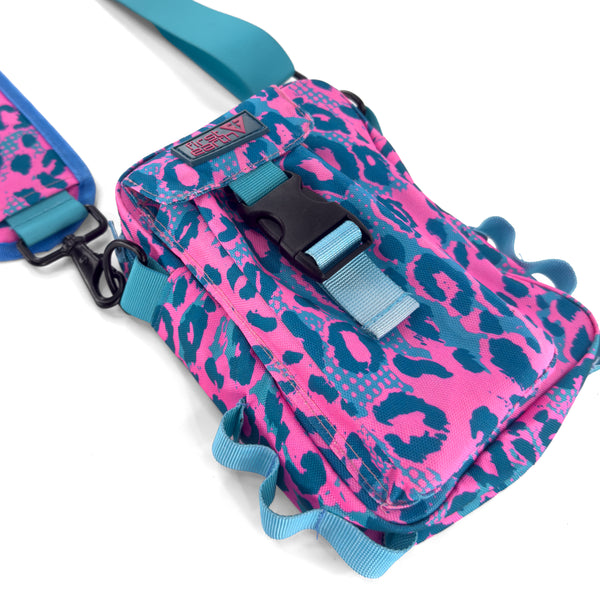 First Earth Asanoha Pink Sling Bag — UV-reactive sacred-geometry rave bag built for hands-free spinning and flow.