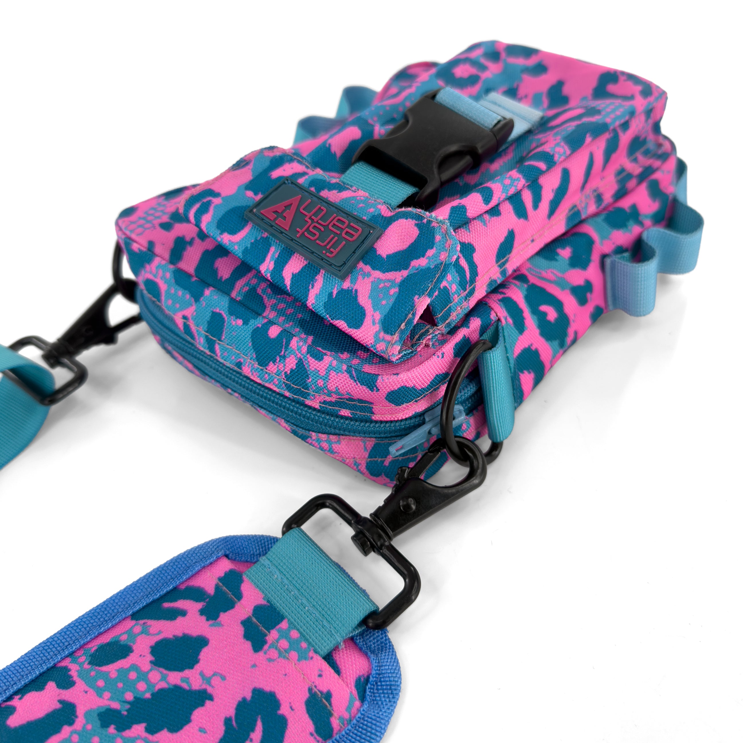 First Earth Asanoha Pink Sling Bag — UV-reactive sacred-geometry rave bag built for hands-free spinning and flow.