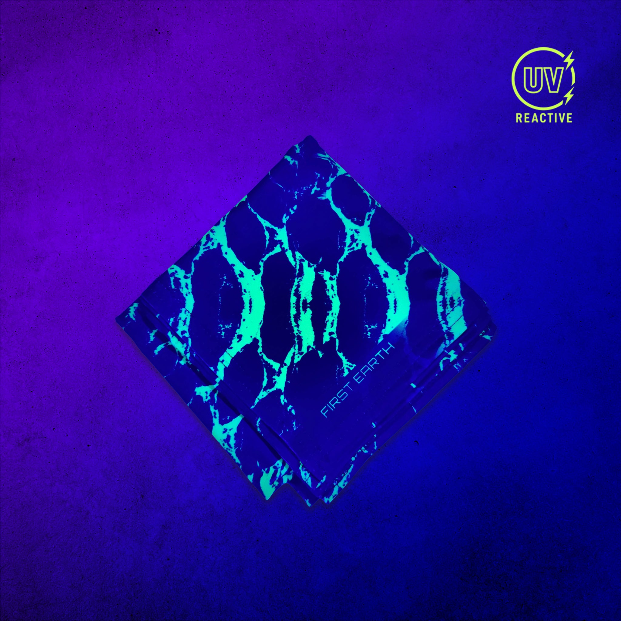 Neon Snake - UV Glow - Bandana glowing under black light, showing the UV-reactive colors and complete printed design