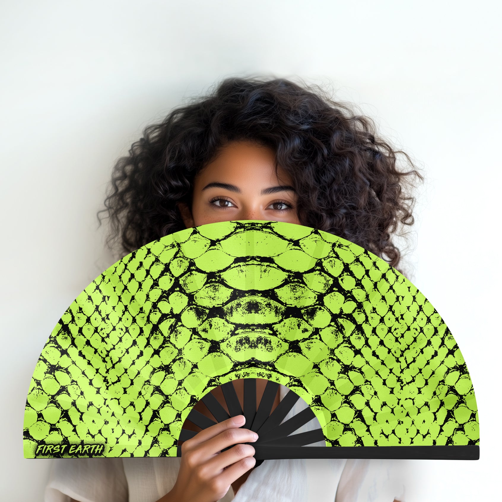 Neon Snake UV glow hand fan by First Earth – radiant rave fan with glowing serpent design, bamboo ribs, and vibrant poly fabric—great for summer sets