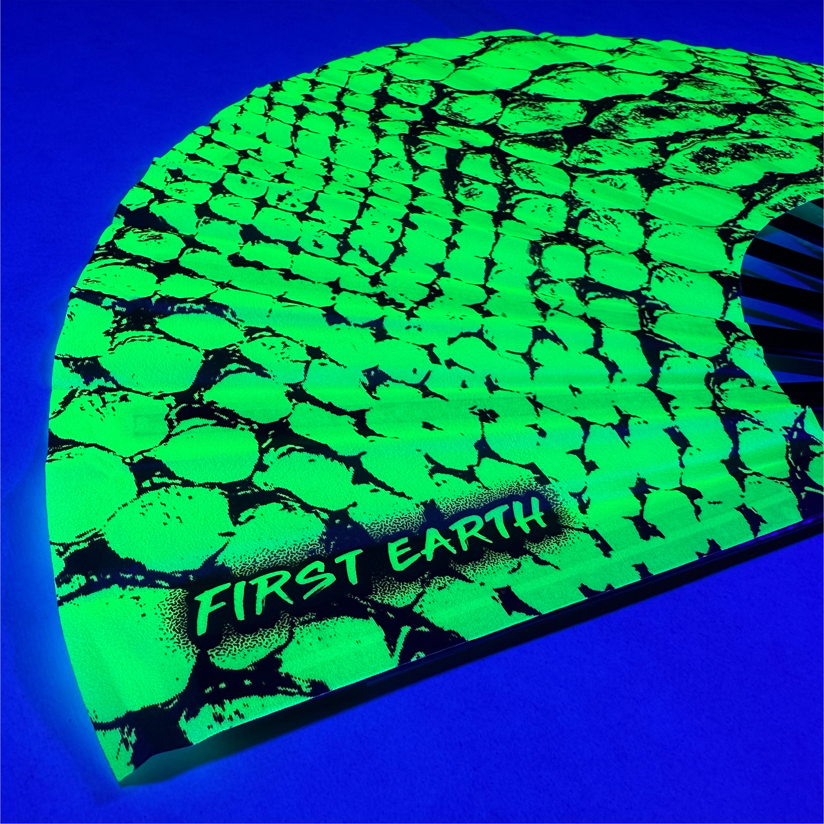 Neon Snake UV glow hand fan by First Earth – radiant rave fan with glowing serpent design, bamboo ribs, and vibrant poly fabric—great for summer sets