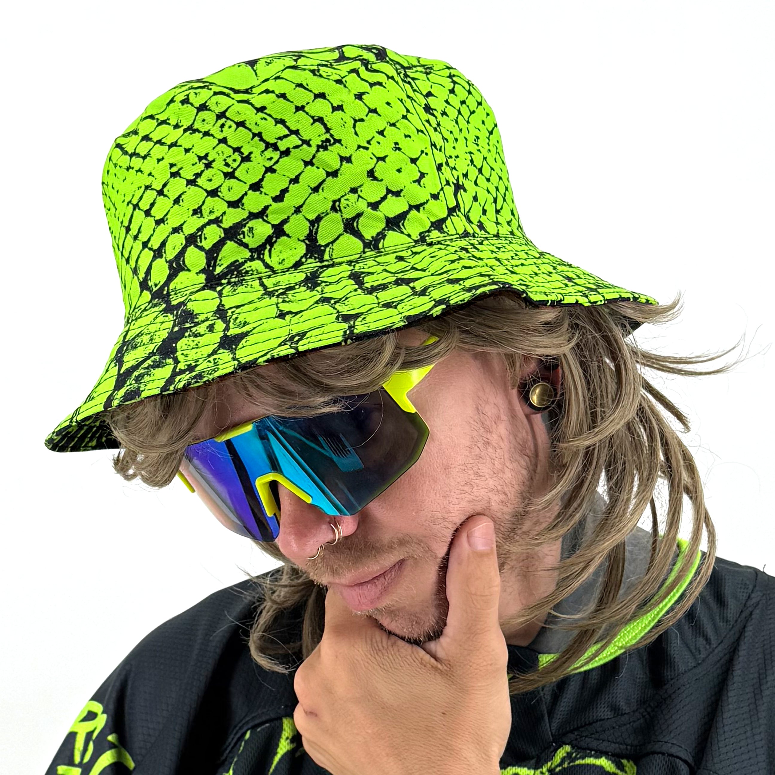Neon Serpent UV bucket hat by First Earth – reversible rave hat with glowing serpent design on both sides, lightweight and breathable for sun-safe festival flow 