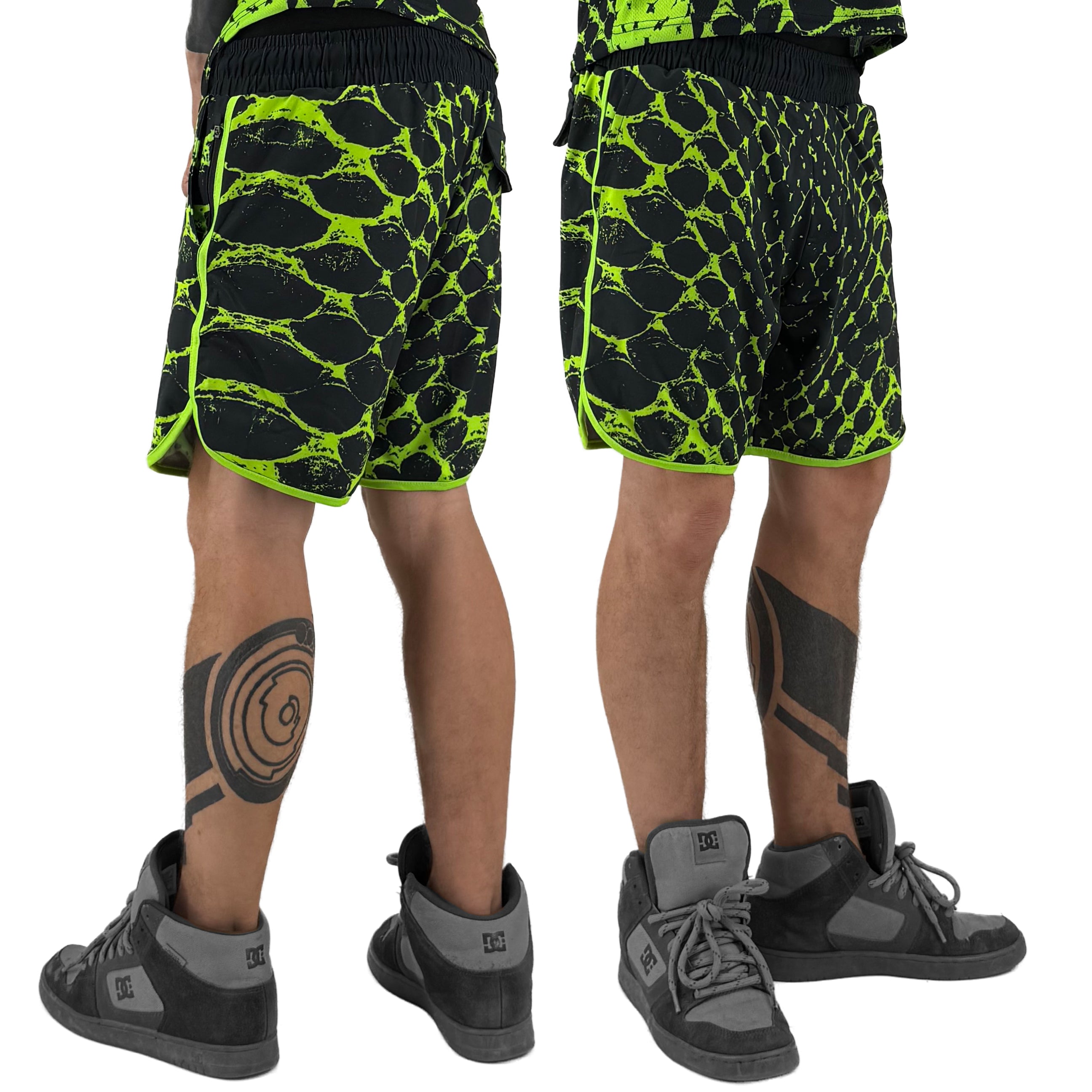 Neon Serpent UV shorts by First Earth – rave-ready shorts with glowing serpent design that shines under blacklight, lightweight breathable mesh, zip and velcro pockets for festival flow