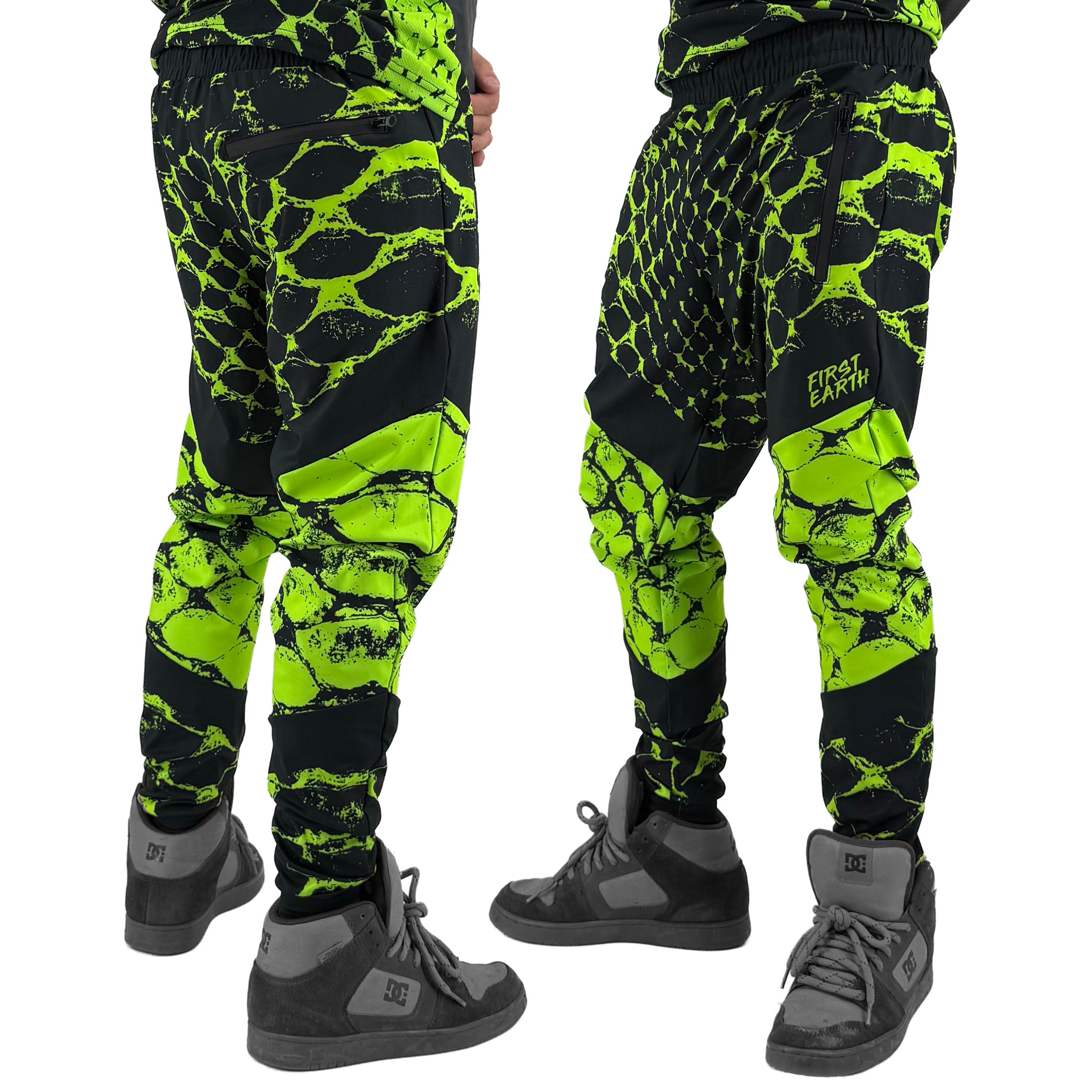 Neon Serpent UV joggers by First Earth – rave-worthy pants with glowing serpent design under blacklight, breathable soft polyester, zip pockets, and elastic drawstring waistband 