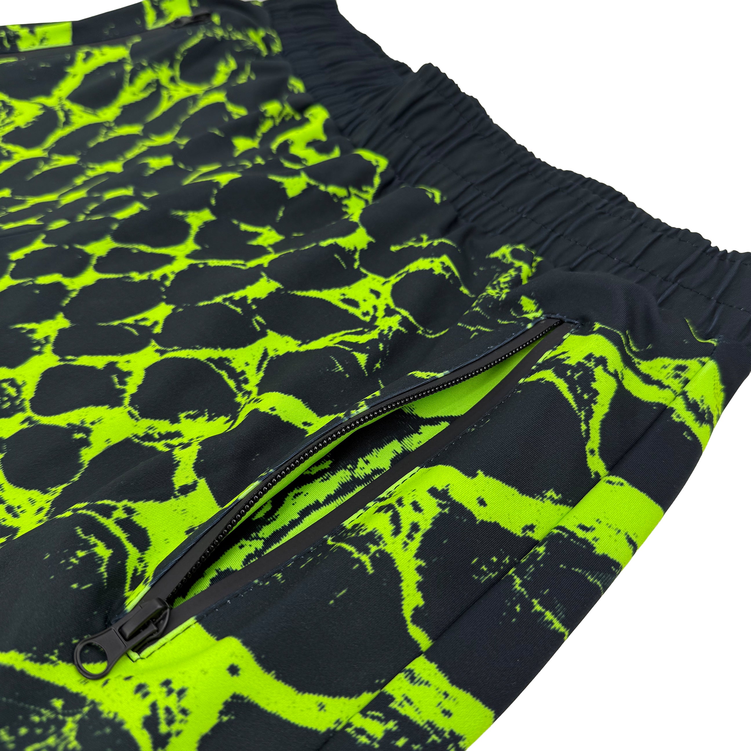 Neon Serpent UV joggers by First Earth – rave-worthy pants with glowing serpent design under blacklight, breathable soft polyester, zip pockets, and elastic drawstring waistband 