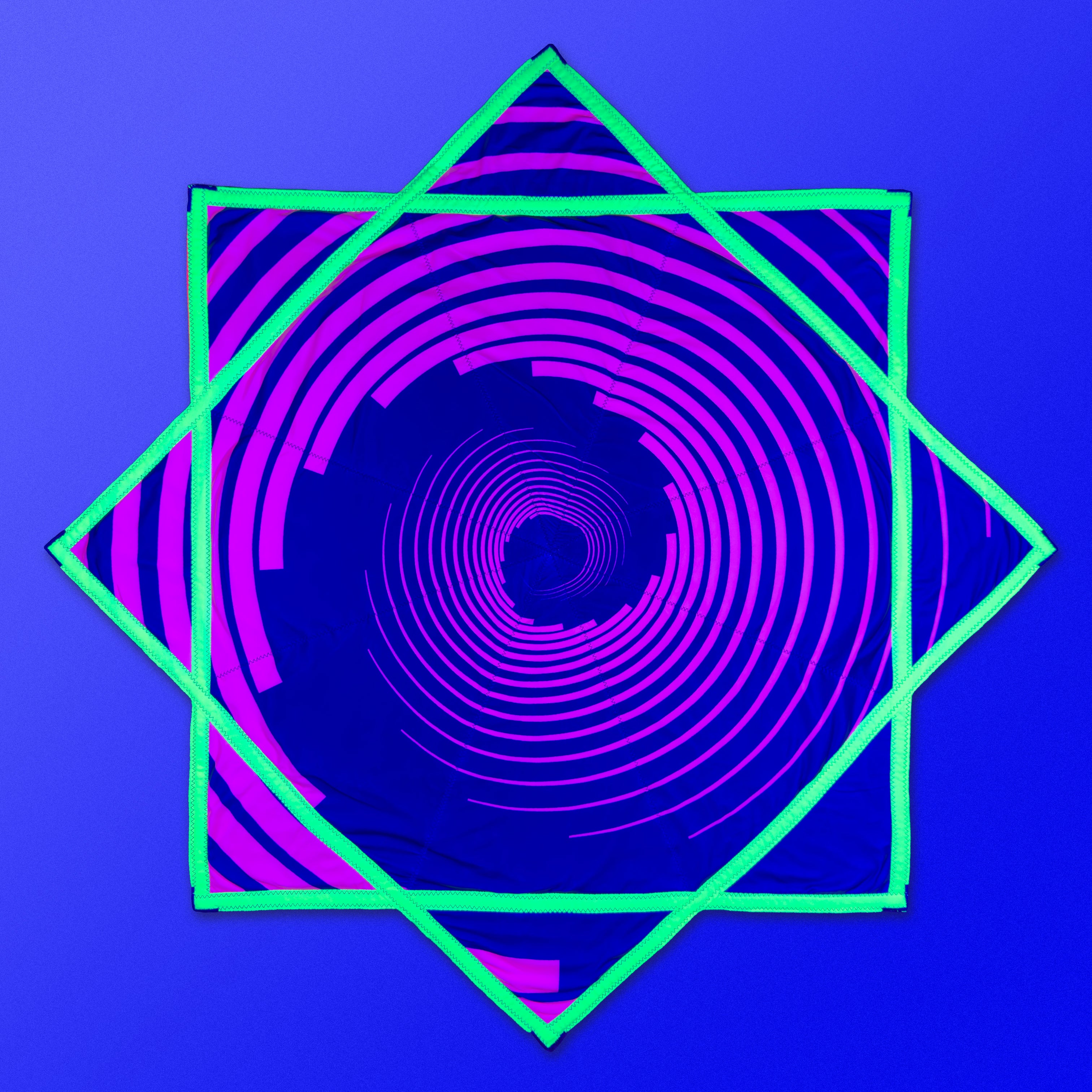 First Earth Spiral 1 48” Mega Kaiju Flow Star — color-switch UV rave prop built for huge, smooth spinning.