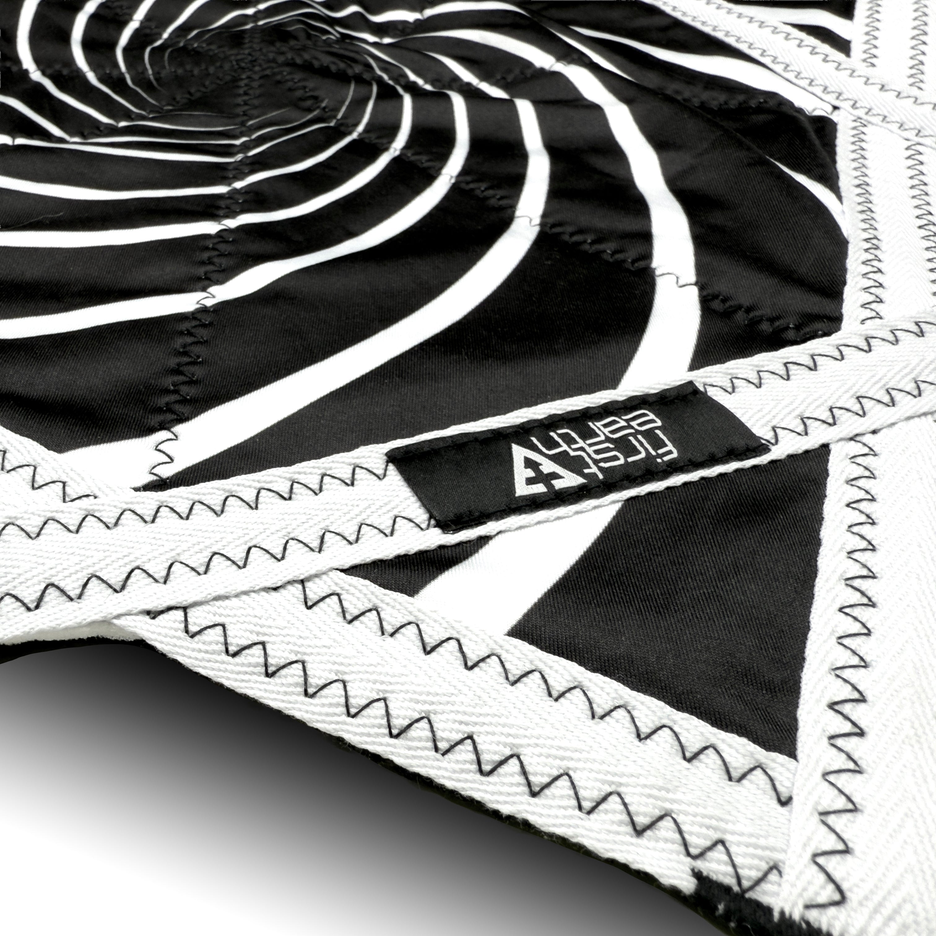 First Earth Mini Spiral 2 UV Flow Star — black and white 20” rave prop designed for fast, smooth spinning.