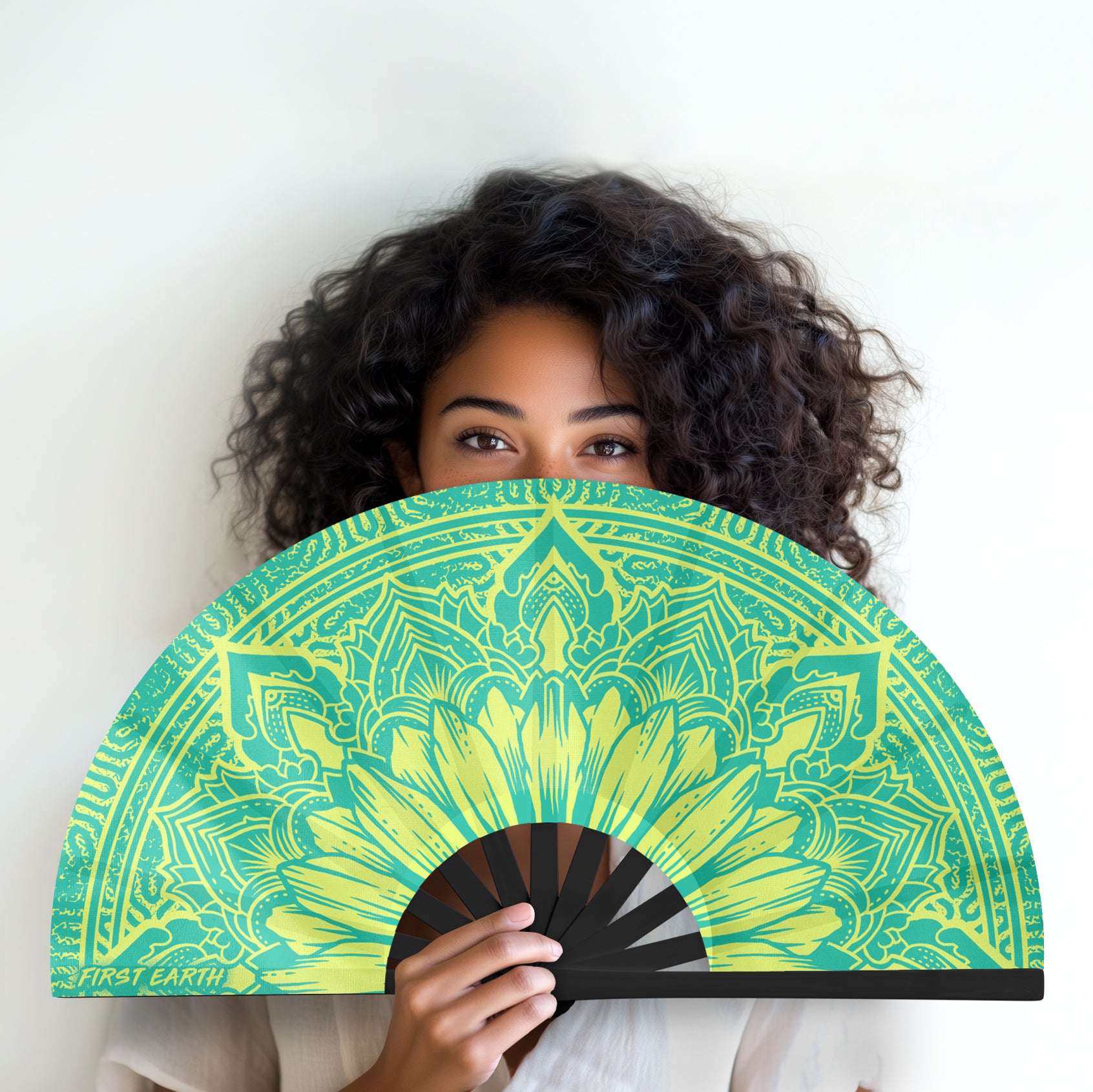 Sunflower UV glow hand fan by First Earth – folding rave fan with glowing sunflower design under blacklight, bamboo frame, and vibrant polyester for airflow on the dance floor 