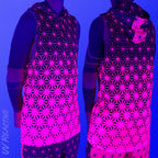 First Earth Asanoha Pink UV hooded mesh tank top under blacklight on model showing glowing pink asanoha pattern front and back