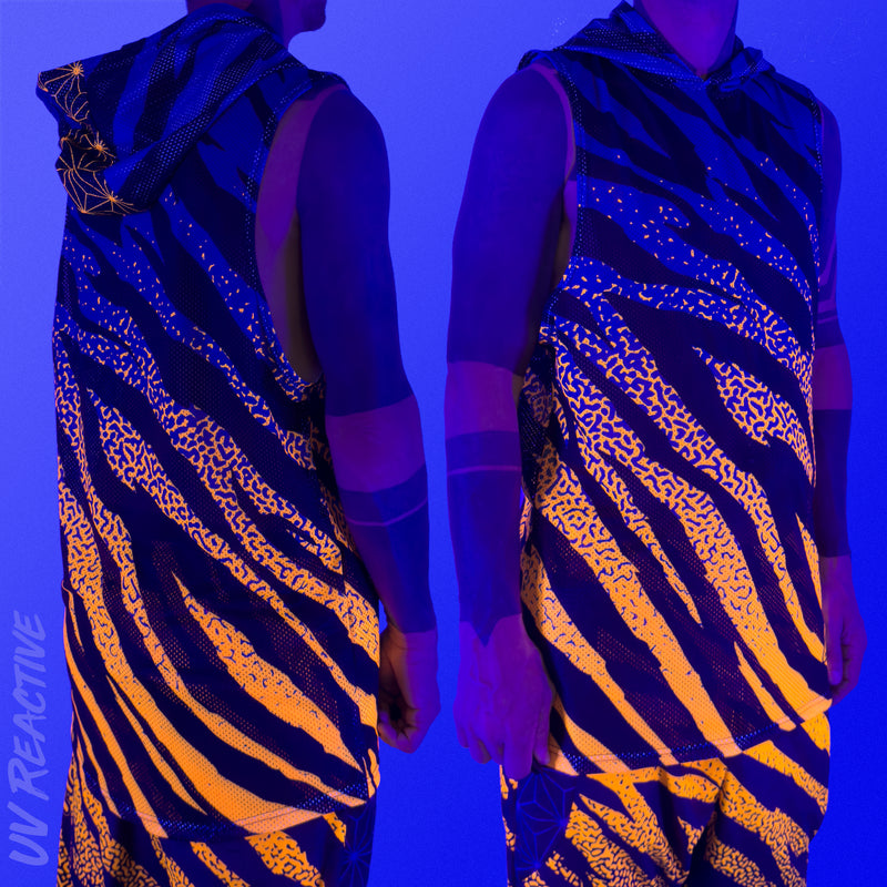 First Earth Sacred Stripes UV hooded mesh tank top under blacklight on model showing glowing orange tiger stripe design front and back