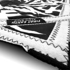 Close-up of First Earth Tempest Blackout 20-inch mini flow star zig-zag stitching and thicker trim