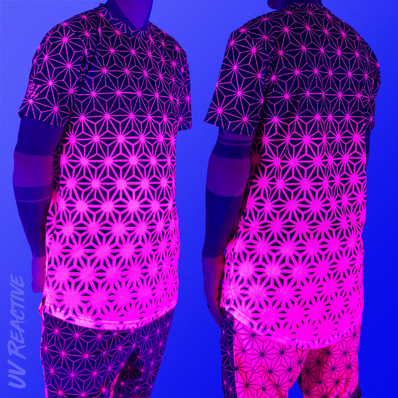 First Earth Asanoha Pink UV mesh t-shirt under blacklight on model showing glowing pink asanoha pattern front and back