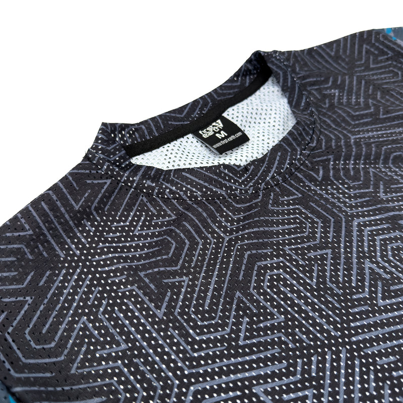 First Earth Shadow mesh t-shirt close up showing collar, tag, and breathable mesh fabric