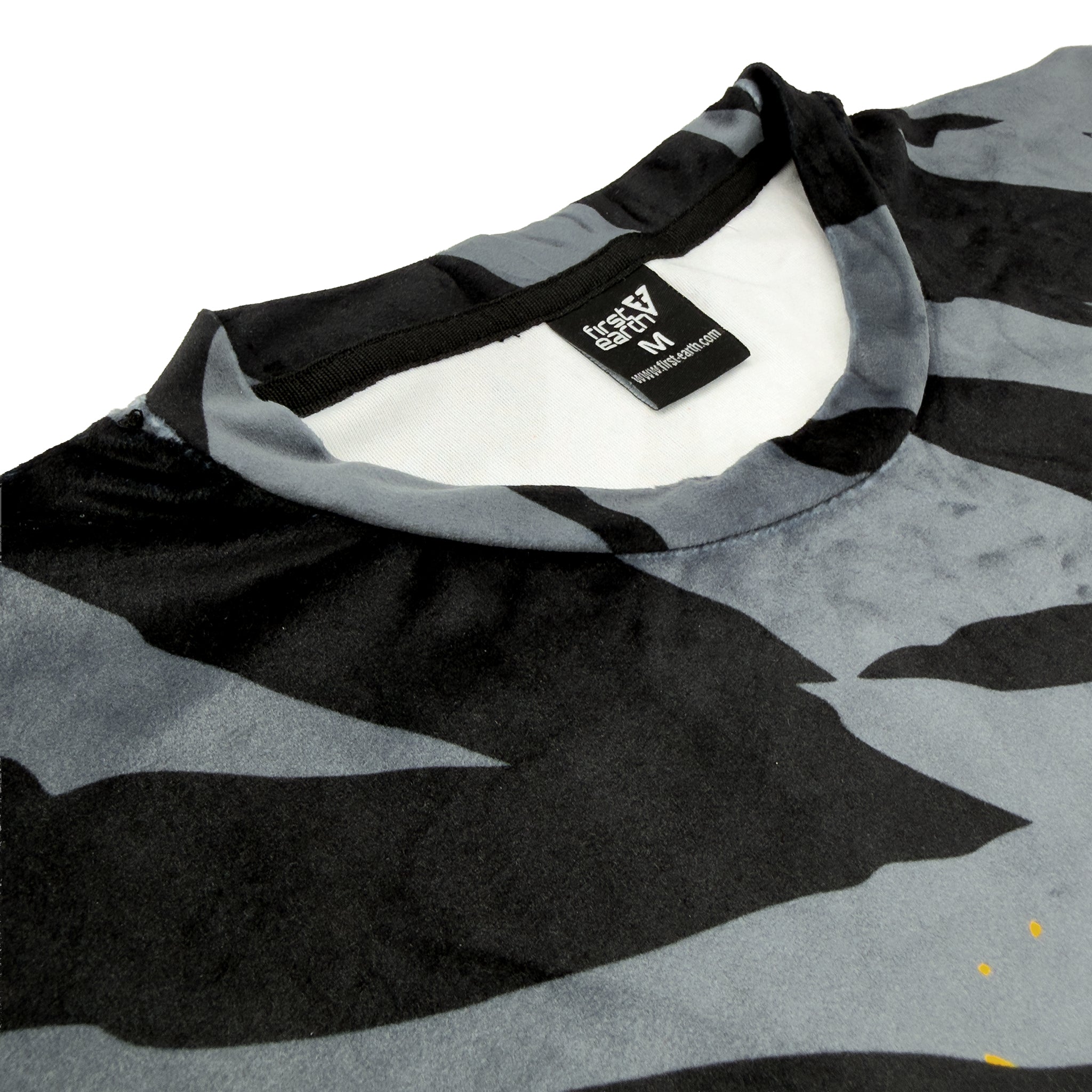 First Earth Sacred Stripes velvet t-shirt close up showing collar, tag, and soft fabric