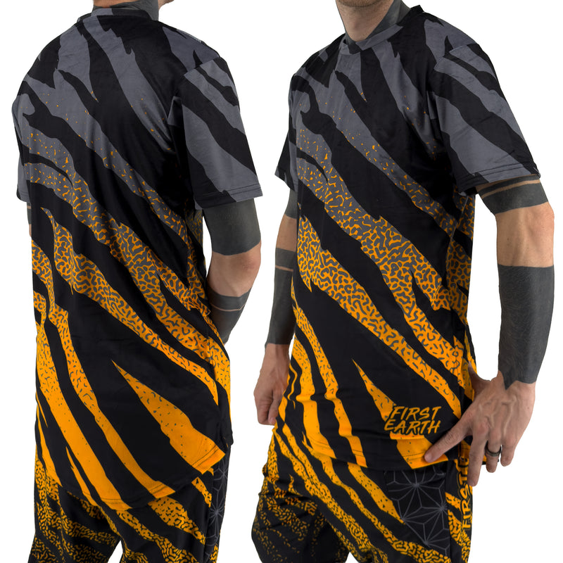 First Earth Sacred Stripes UV mesh t-shirt on model showing front and back views with orange tiger stripe design