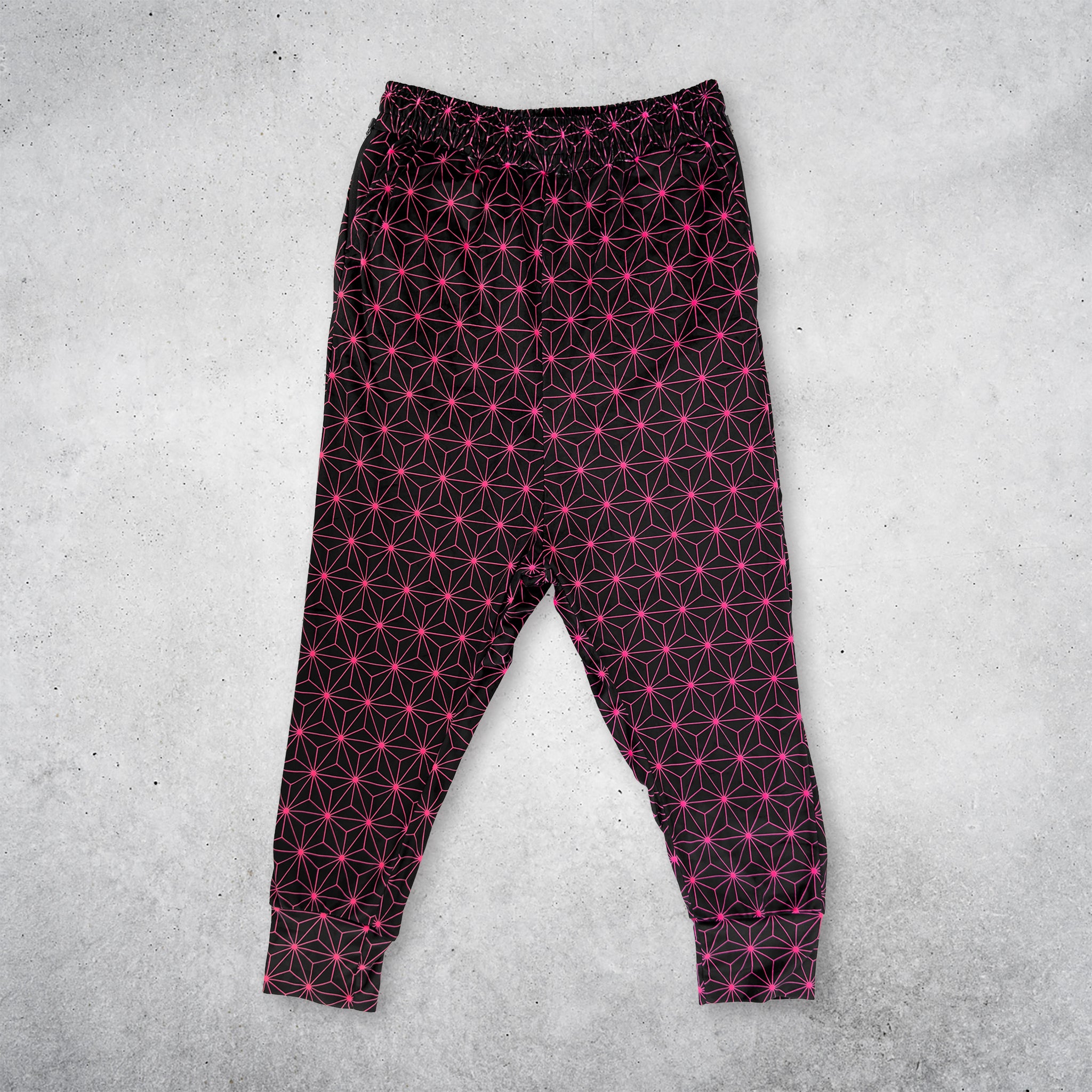 First Earth Asanoha Pink UV velvet harem joggers front with neon pink asanoha pattern on black velvet