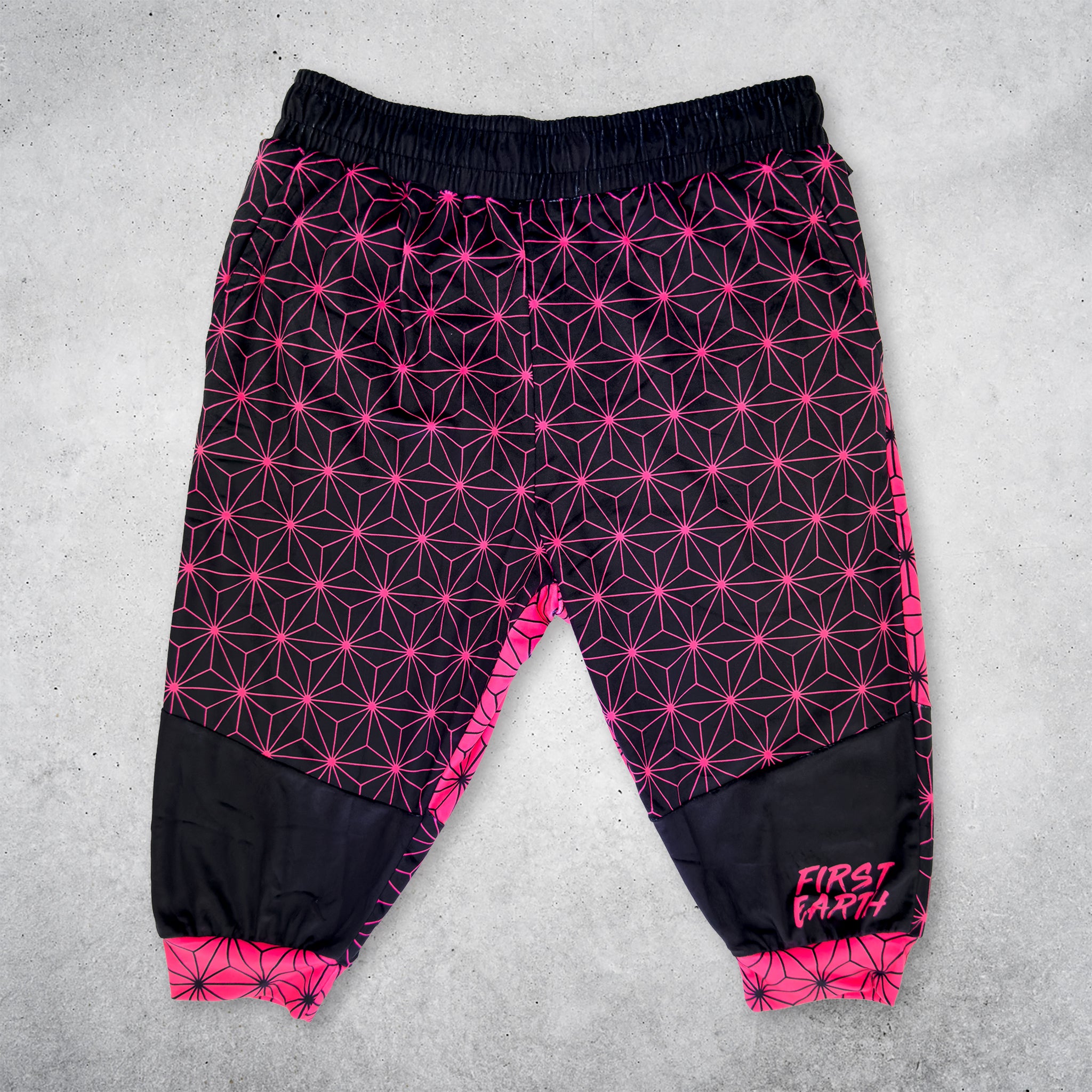 First Earth Asanoha Pink UV velvet 3/4 jogger shorts front on concrete background