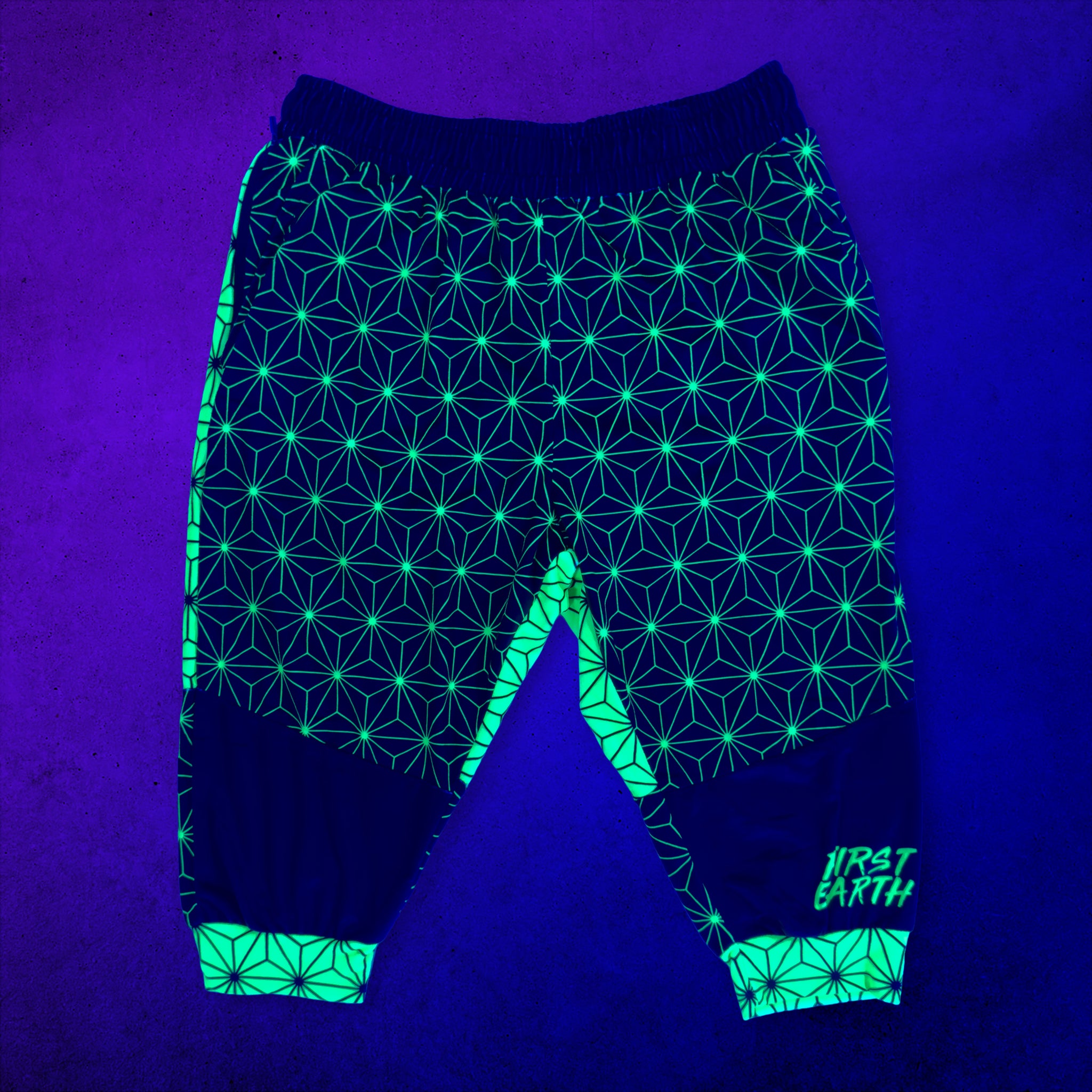 First Earth Asanoha Yellow UV velvet 3/4 jogger shorts front glowing under black light