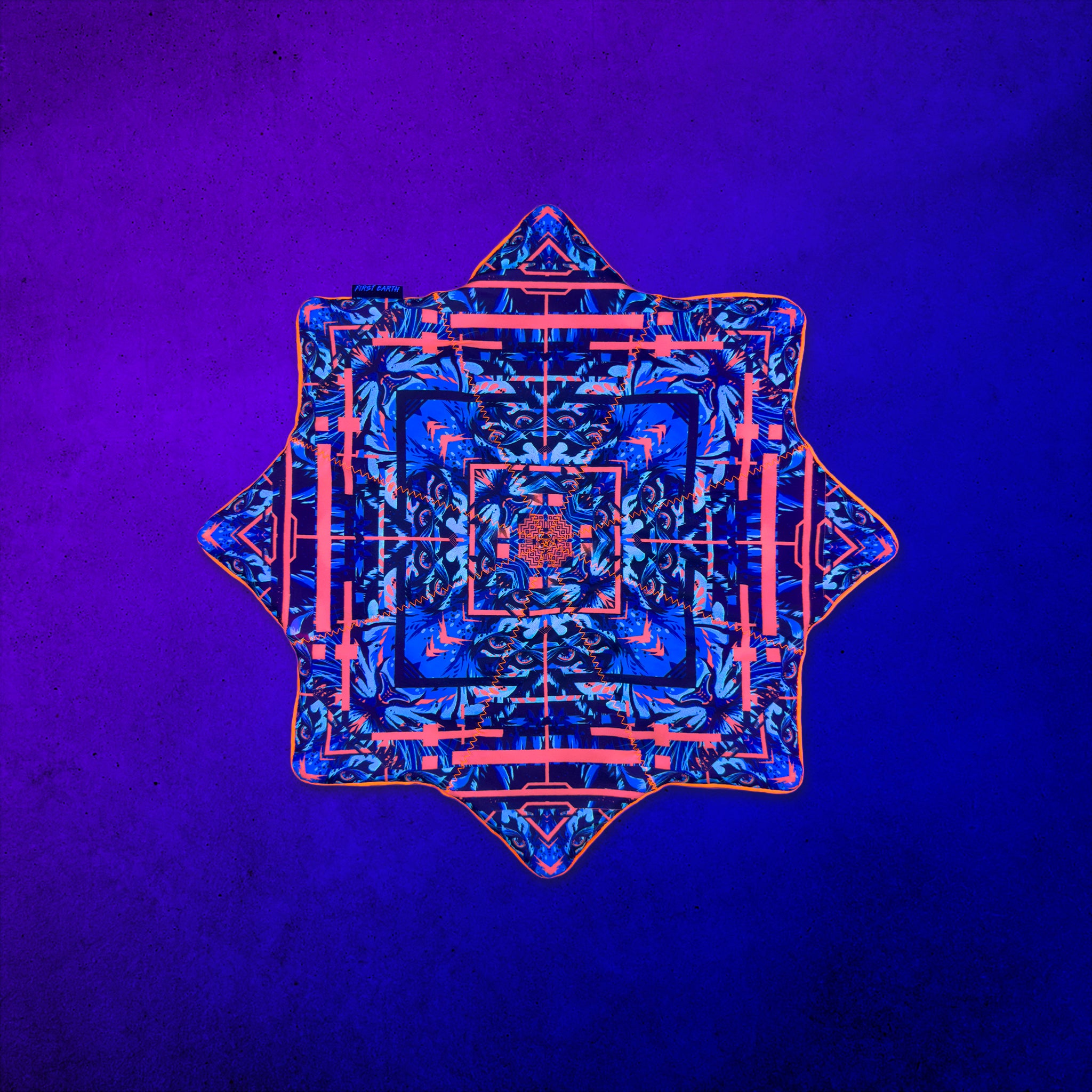 Glitch Tiger Orange 20 inch UV Flow Star by First Earth spinning, back side under UV blacklight